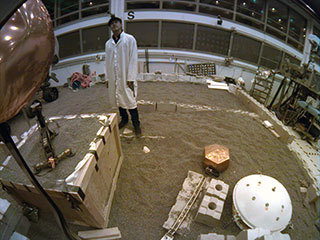 In a Mars-like environment at NASA's Jet Propulsion Laboratory, the fish-eye instrument context camera aboard NASA's InSight lander snapped this image of the actor Brad Pitt on Sept. 6, 2019. Pitt visited JPL to learn about real space technology after filming his space-themed movie "Ad Astra."