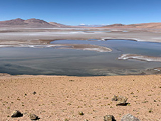 Filled with briny lakes, the Quisquiro salt flat in South America's Altiplano represents the kind of landscape that scientists think may have existed in Gale Crater, which NASA's Curiosity rover is exploring.