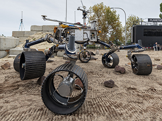 An engineering model of NASA's Mars 2020 rover makes tracks during a driving test in the Mars Yard, an area that simulates Mars-like conditions at NASA's Jet Propulsion Laboratory in Pasadena, California. 