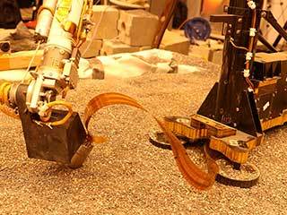 This test using an engineering model of the InSight lander here on Earth shows how the spacecraft on Mars will use its robotic arm to press on a digging device, called the "mole."