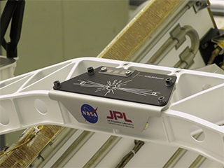 A placard commemorating NASA's "Send Your Name to Mars" campaign on the Perseverance Mars rover