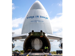 The first stage of the Atlas V that will carry Perseverance rover into space is offloaded from a cargo plane at Kennedy Space Center in Florida