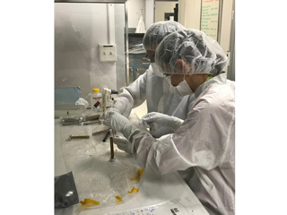 Engineers clean the tubes that will store Martian rock
