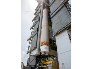 The booster for Mars 2020 is lifted up in the Vertical Integration Facility in Florida