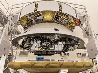 The Mars 2020 Perseverance rover mission's disk-shaped cruise stage sits atop the back shell, which contains the powered descent stage and Perseverance rover. 