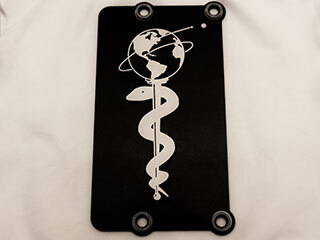 Attached to the Perseverance Mars rover, this 3-by-5-inch aluminum plate commemorates the impact of the COVID-19 pandemic.