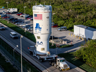 the Centaur upper stage being transported by a big truck