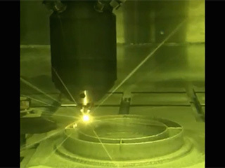 3D printing technique where a printer head scans over each layer of a part, blowing metal powder that is melted by a laser