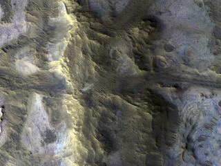 This image acquired on October 12, 2020 by NASAs Mars Reconnaissance Orbiter, shows an isolated, elongated mound (about 1 mile wide and 3.75 miles long) rising above the smooth, surrounding plains.