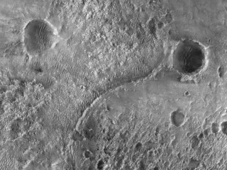 This first image of NASA’s Perseverance Rover on the surface of Mars from the HiRISE camera aboard NASA’s Mars Reconnaissance Orbiter 