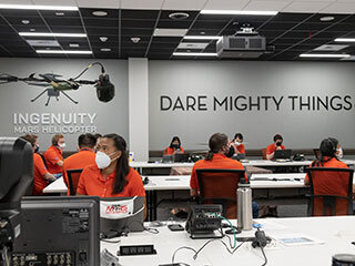 Members of NASA’s Ingenuity helicopter team in the Space Flight Operations Facility at NASA’s Jet Propulsion Laboratory prepare to receive the data downlink showing whether the helicopter completed its first flight on April 19, 2021.