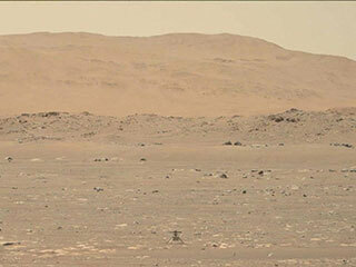 In this video captured by NASA’s Perseverance rover, the agency's Ingenuity Mars Helicopter took the first powered, controlled flight on another planet on April 19, 2021. 