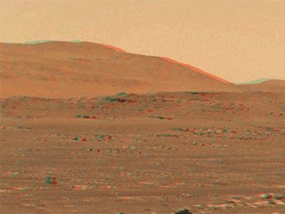 After the Mastcam-Z imager aboard NASA’s Perseverance rover captured Ingenuity’s third flight on April 25, the frames of the video that was stitched together were then reprojected to optimize viewing in an anaglyph, or an image seen in 3D when seen through color-filtered glasses.