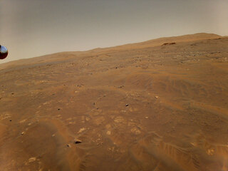 This image of Mars was taken from the height of 33 feet (10 meters) by NASA’s Ingenuity Mars helicopter during its sixth flight on May 22, 2021.