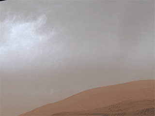 This GIF shows clouds drifting over Mount Sharp on Mars, as viewed by NASA’s Curiosity rover on March 19, 2021, the 3,063rd Martian day, or sol, of the mission. Each frame of the scene was stitched together from six individual images.