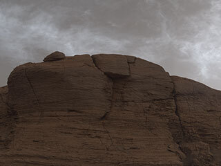 NASA’s Curiosity Mars rover captured these clouds just after sunset on March 19, 2021, the 3,063rd Martian day, or sol, of the rover’s mission. The image is made up of 21 individual images stitched together and color corrected so that the scene appears as it would to the human eye.