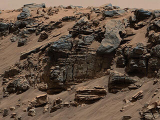 This evenly layered rock photographed by the Mast Camera (Mastcam) on NASA's Curiosity Mars Rover shows a pattern typical of a lake-floor sedimentary deposit not far from where flowing water entered a lake.