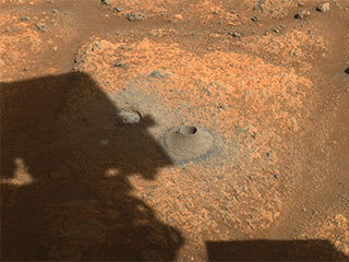 This image taken by NASA’s Perseverance rover on Aug. 6, 2021, shows the hole drilled in a Martian rock in preparation for the rover’s first attempt to collect a sample.
