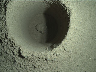 This composite image of Perseverance’s first borehole on Mars was generated using multiple images taken by the rover’s WATSON imager.  
