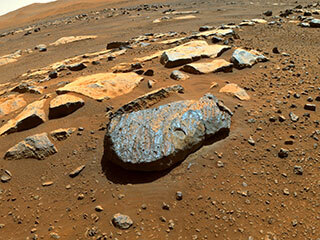 This is a colored image taken by the Perseverance rover of the Martian rock nicknamed "Rochette" after it abraded a circular patch known as "Bellegarde." The patch is about 0.39 inches (10 millimeters) deep and about 2 inches (5 centimeters) in diameter.
The main image was taken by one of the rover's Hazard Avoidance Cameras. A secondary image in which part of the rover deck is visible shows the abrasion patch from the point of view of a Navigation Camera on Perseverance's mast. 