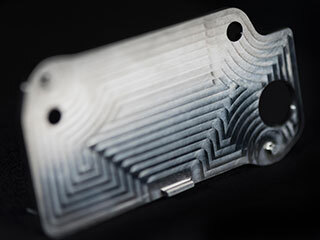 This nickel-alloy heat exchanger is among several that were 3D printed for the Mars Oxygen In-situ Resource Utilization Experiment (MOXIE), one of the instruments aboard NASA's Perseverance Mars rover.
