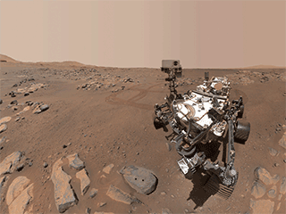 Perseverance Mars rover took a selfie over a rock with two holes where the rover used its robotic arm to drill rock core samples.
