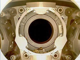 Pebble-sized debris can be seen in the bit carousel of NASA’s Perseverance Mars rover in this Jan. 7, 2022, image.