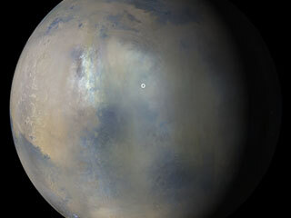 Images acquired Jan. 9, 2022, from the Mars Color Imager instrument on NASA’s Mars Reconnaissance Orbiter were combined to create this view showing the presence of a regional dust storm obscuring the location of Perseverance rover and Ingenuity Mars Helicopter (white circle).  