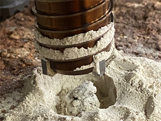 Engineers at NASA’s Jet Propulsion Laboratory performed tests on rocks such as this one to understand why the first attempt by the agency’s Perseverance rover resulted in a powderized sample. A duplicate of the rover’s drill attempted to create cores from crumbly rocks.