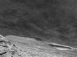 Clouds can be seen drifting across the Martian sky in an 8-frame movie made using images from a navigation camera aboard NASA’s Curiosity rover. The images were taken on Dec. 12, 2021, the 3,325th Martian day, or sol, of the mission.
