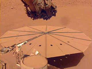 InSight captured this image of one of its dust-covered solar panels on April 24, 2022, the 1,211th Martian day, or sol, of the mission.