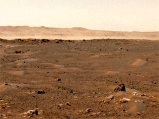 This series of images from a navigation camera aboard NASA’s Perseverance rover shows a gust of wind sweeping dust across the Martian plain beyond the rover’s tracks on June 18, 2021 (the 117th sol, or Martian day, of the mission). The dust cloud in this GIF was estimated to be 1.5 square miles (4 square kilometers) in size; it was the first such Martian wind-lifted dust cloud of this scale ever captured in images.