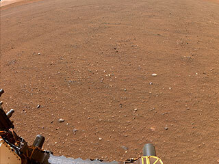 Flat terrain in Jezero Center captured by one of NASA's Perseverance Mars rover's navigation cameras.