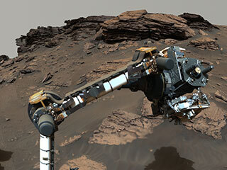 NASA’s Perseverance rover puts its robotic arm to work around a rocky outcrop called “Skinner Ridge” in Mars’ Jezero Crater.