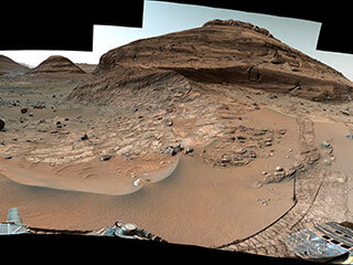 NASA’s Curiosity Mars rover used its Mast Camera, or Mastcam, to capture this panorama while driving toward the center of this scene, an area that forms the narrow “Paraitepuy Pass” on Aug. 14, the 3,563rd Martian day, or sol, of the mission.