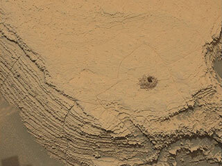 Curiosity used its Mast Camera, or Mastcam, to capture this image of its 36th successful drill hole on Mount Sharp, at a rock called “Canaima.” The rovers Mars Hand Lens Imager took the inset image.