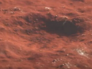 This animation depicts a flyover of a meteoroid impact crater on Mars that’s surrounded by boulder-size chunks of ice. 