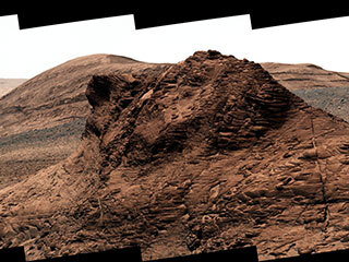 At the bottom of this valley, called Gediz Vallis, is a mound of boulders and debris that are believed to have been swept there by wet landslides billions of years ago.