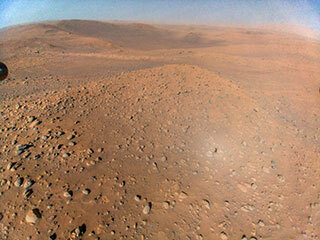 This image of NASA’s Perseverance Mars rover at the rim of Belva Crater was taken by the agency’s Ingenuity Mars Helicopter during the rotorcraft’s 51st flight on April 22, 2023, the 772nd Martian day, or sol, of the rover’s mission. 