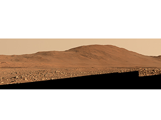 Image shows a mosaic photograph of the rim of Mars' Jezero Crater on sol 847 of the Perseverance rover's mission, and was taken by Perseverance's Mastcam-Z instrument as the rover looked west.