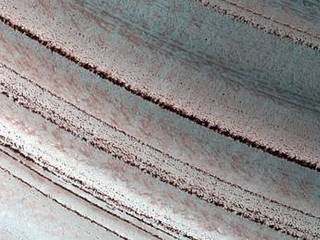 Icy Layers and Climate Fluctuations near the Martian North Pole