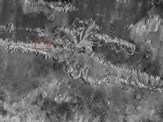 Valles Marineris, the "Grand Canyon of Mars," sprawls wide enough to reach from Los Angeles to nearly New York City, if it were located on Earth. The red outline box shows the location of a second, full-resolution image.