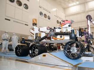 The suspension system on NASA Mars rover Curiosity easily accommodates rolling over a ramp in this Sept. 10, 2010, test drive inside the Spacecraft Assembly Facility at NASA's Jet Propulsion Laboratory, Pasadena, Calif.