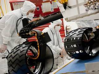 Test operators monitor how NASA's Mars rover Curiosity handles driving over a ramp during a test on Sept. 10, 2010, inside the Spacecraft Assembly Facility at NASA's Jet Propulsion Laboratory, Pasadena, Calif.