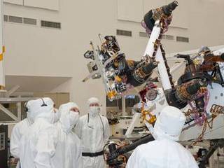 Testing of the robotic arm on NASA's Mars rover Curiosity on Sept. 3, 2010, included movements of the arm while the rover was on a table tilted to 20 degrees to simulate a sloped surface on Mars.