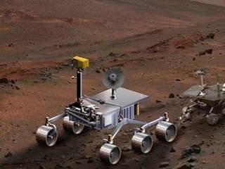 An artist's concept of NASA's Mars Science Laboratory (left) serves to compare it with Spirit, one of NASA's twin Mars Exploration Rovers.