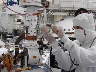 Sensors on two finger-like mini-booms extending horizontally from the mast of NASA's Mars rover Curiosity will monitor wind speed, wind direction and air temperature.
