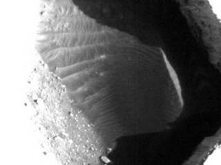 This enhanced image shows the inside of a rimless pit about 180 meters (591 feet) in diameter, northwest of the mountain Ascraeus Mons in the northern hemisphere of Mars.