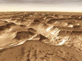 West of Valles Marineris lies a checkerboard named Noctis Labyrinthus, which formed when the Martian crust stretched and fractured.