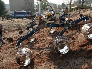 An engineering model for NASA's Mars Science Laboratory makes its way up a hill in the Mars Yard testing area at NASA's Jet Propulsion Laboratory.